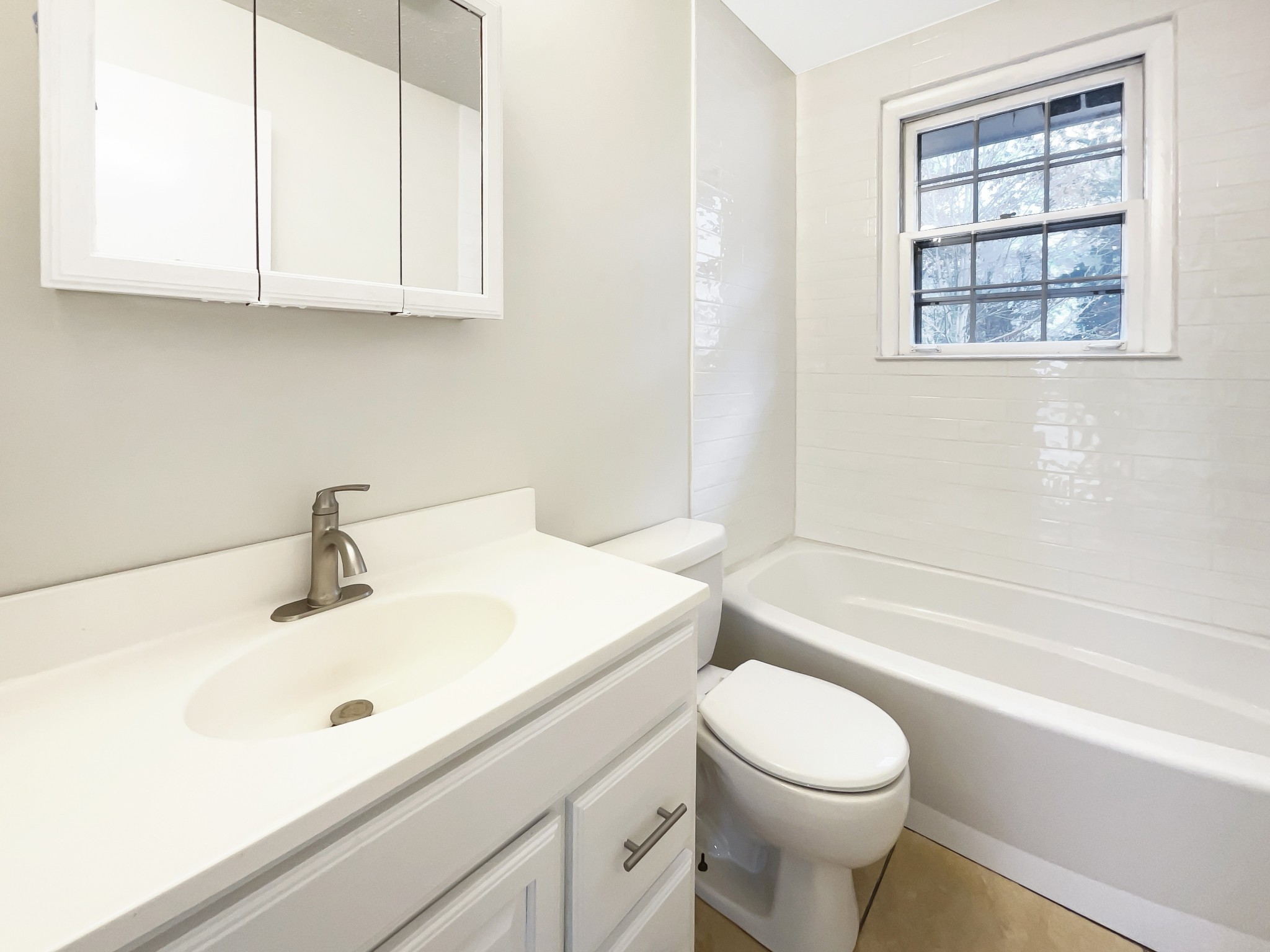 7114 Crow Cut Road Fairview, TN 37062 - Photo 10 of 18 a bathroom with a sink a toilet and bathtub