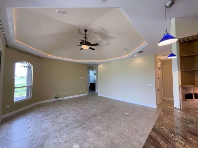 a spacious bathroom with a granite countertop sink mirror and a