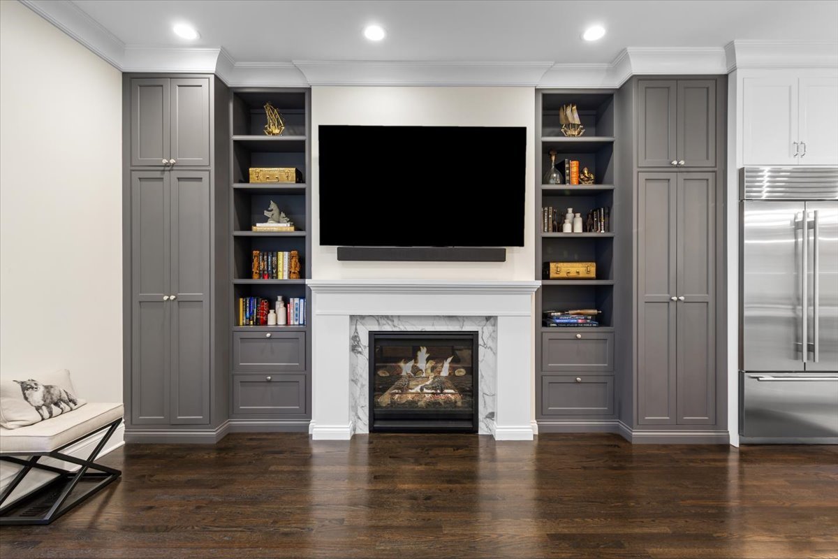 Undisclosed Address Chicago, IL 60622 - Photo 12 of 41 a living room with furniture a fireplace and a flat screen tv