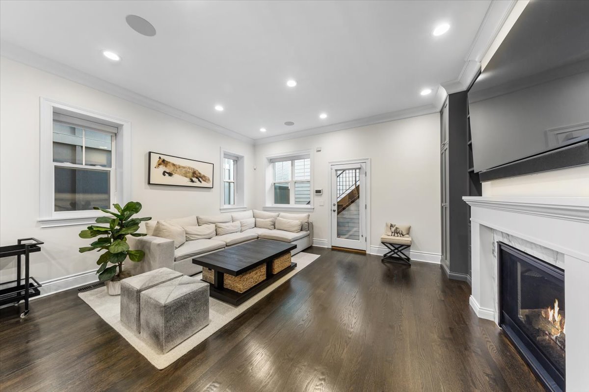Undisclosed Address Chicago, IL 60622 - Photo 13 of 41 a living room with furniture and a fireplace