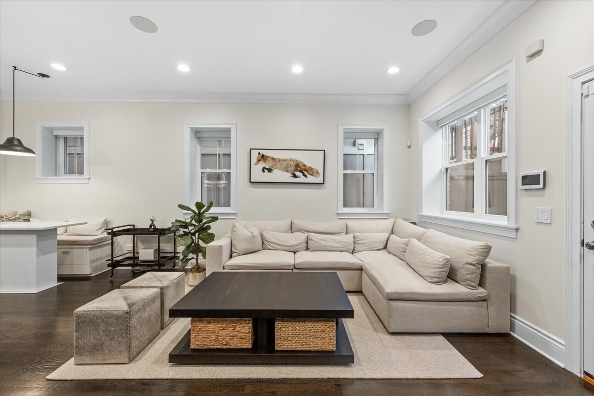 Undisclosed Address Chicago, IL 60622 - Photo 14 of 41 a living room with furniture a rug and a window