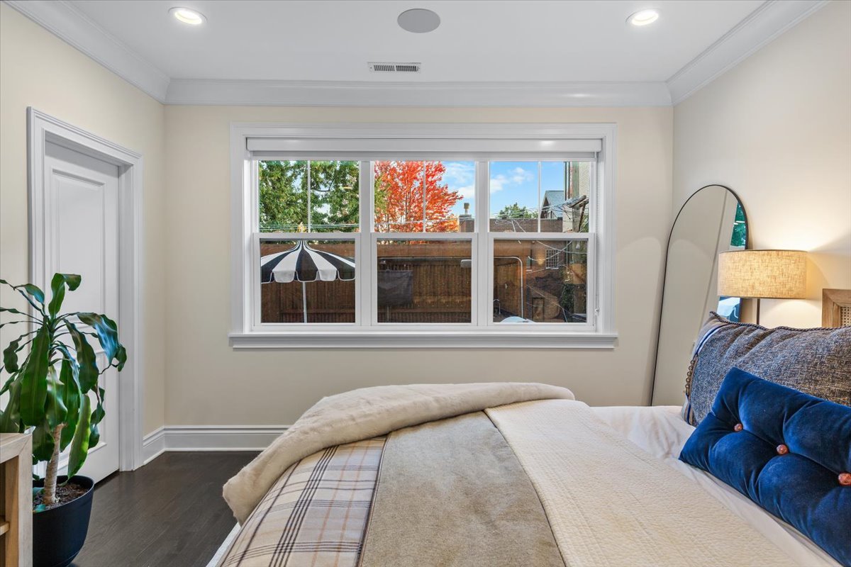 Undisclosed Address Chicago, IL 60622 - Photo 18 of 41 a bedroom with a bed and a large window