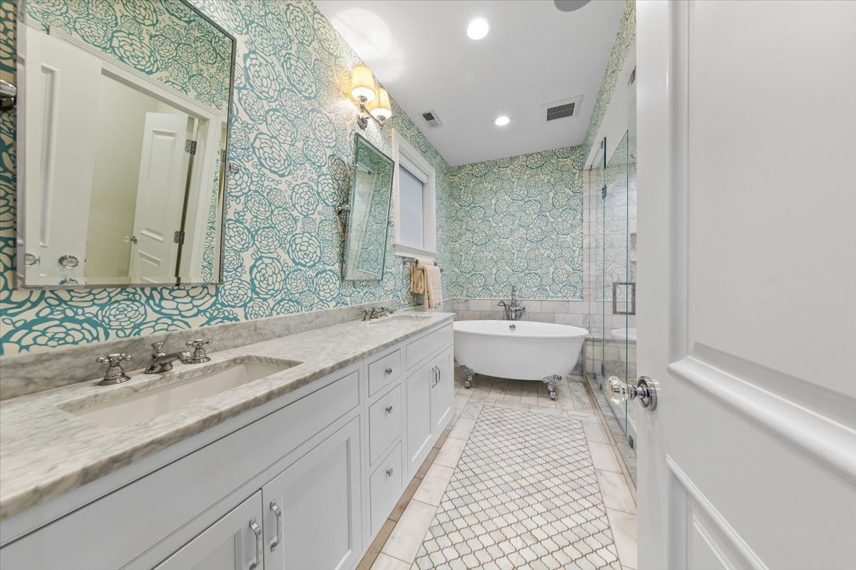Undisclosed Address Chicago, IL 60622 - Photo 19 of 41 a spacious bathroom with a double vanity sink and mirror