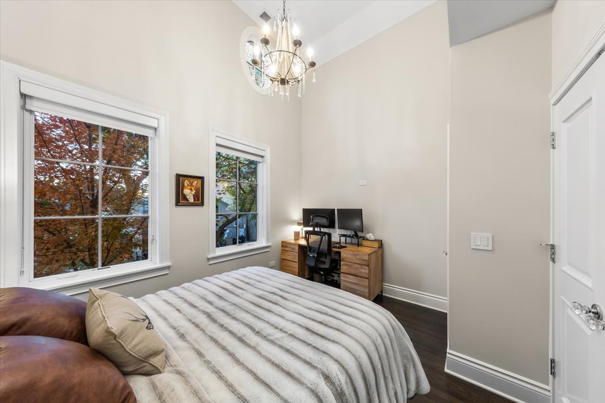 Undisclosed Address Chicago, IL 60622 - Photo 23 of 41 a bedroom with a large bed and a window