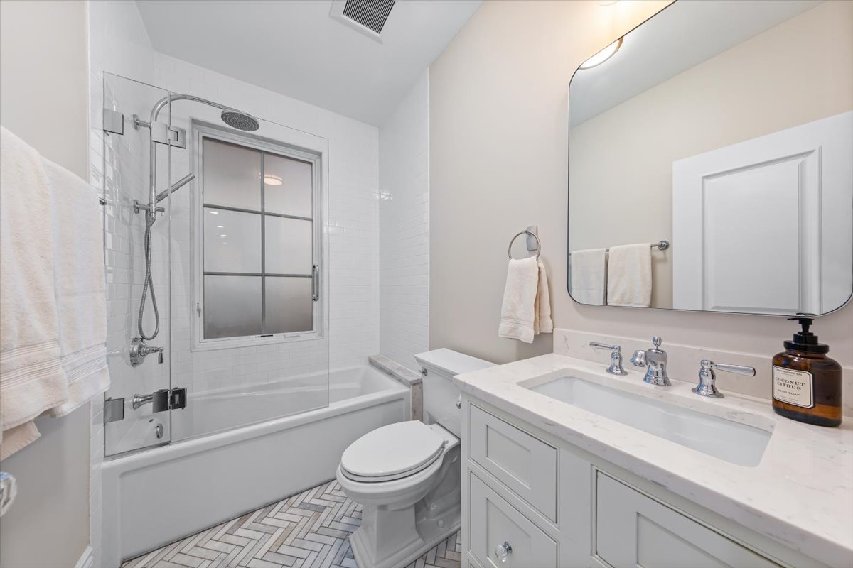 Undisclosed Address Chicago, IL 60622 - Photo 26 of 41 a bathroom with a granite countertop sink toilet and shower