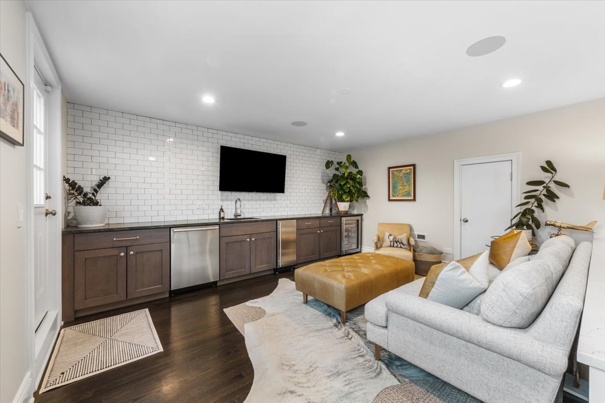 Undisclosed Address Chicago, IL 60622 - Photo 28 of 41 a living room with furniture and a flat screen tv