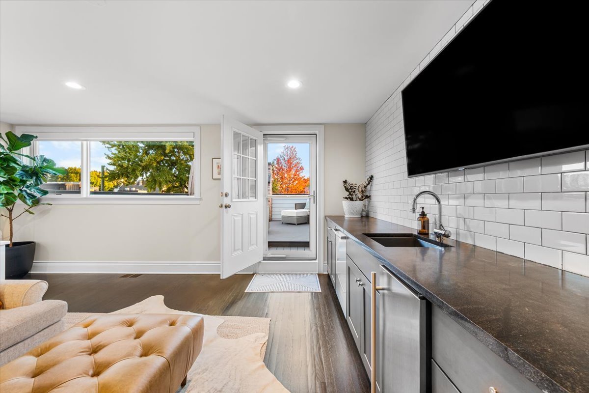 Undisclosed Address Chicago, IL 60622 - Photo 30 of 41 a kitchen with a sink appliances cabinets and a potted plant