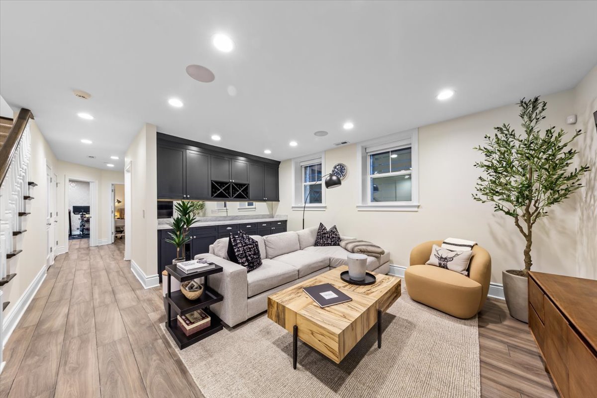 Undisclosed Address Chicago, IL 60622 - Photo 33 of 41 a living room with furniture and a flat screen tv