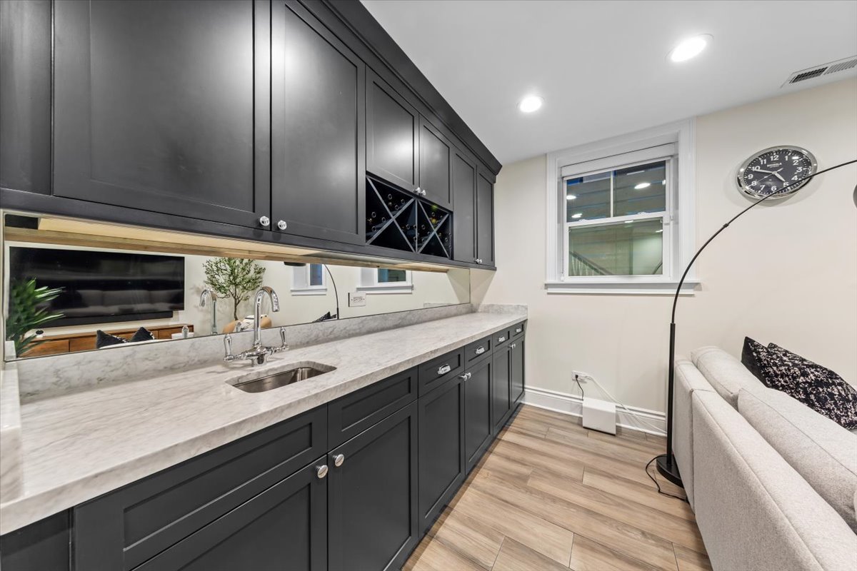 Undisclosed Address Chicago, IL 60622 - Photo 35 of 41 a bathroom with a sink and a large mirror