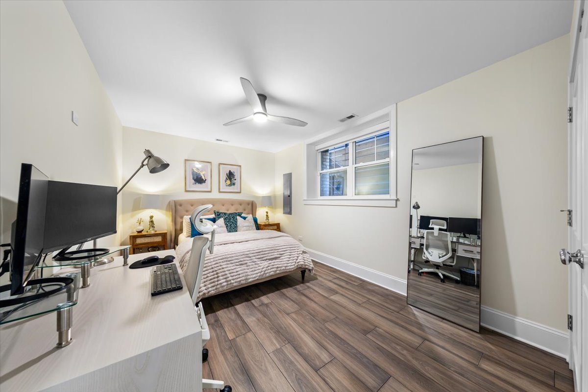 Undisclosed Address Chicago, IL 60622 - Photo 36 of 41 a bedroom with furniture and a flat screen tv