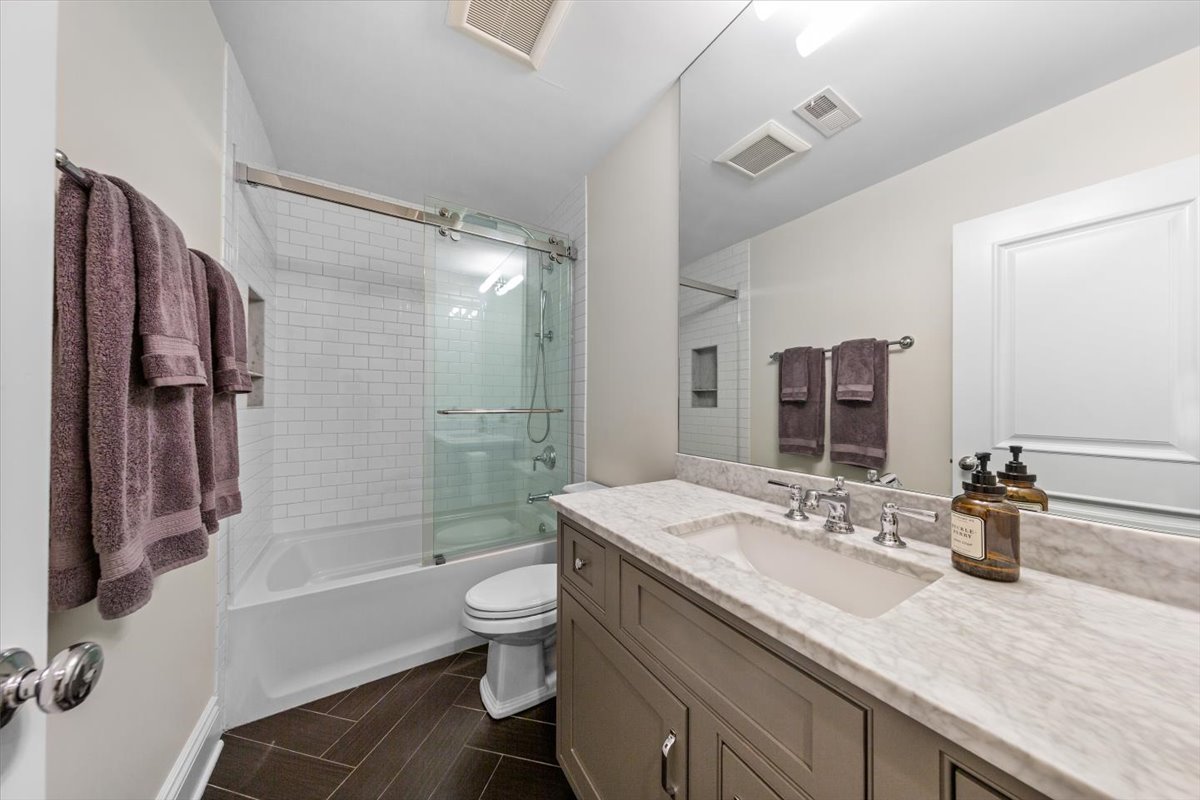 Undisclosed Address Chicago, IL 60622 - Photo 37 of 41 a bathroom with a granite countertop sink toilet and shower