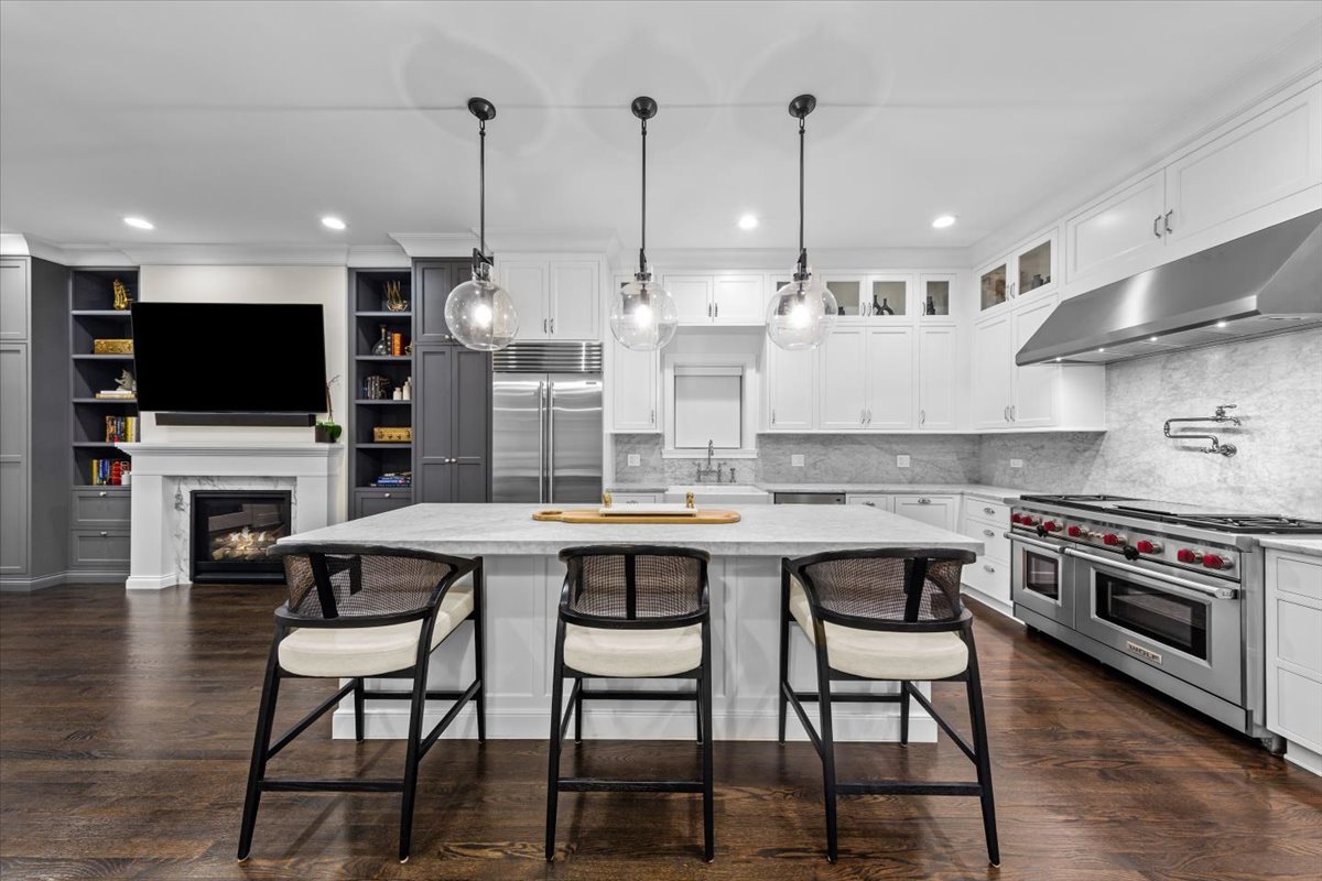 Undisclosed Address Chicago, IL 60622 - Photo 6 of 41 a kitchen with stainless steel appliances kitchen island granite countertop a stove a sink and a microwave