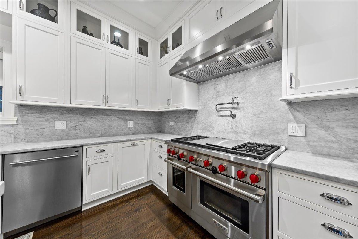 Undisclosed Address Chicago, IL 60622 - Photo 8 of 41 a kitchen with stainless steel appliances granite countertop a stove and a white cabinets