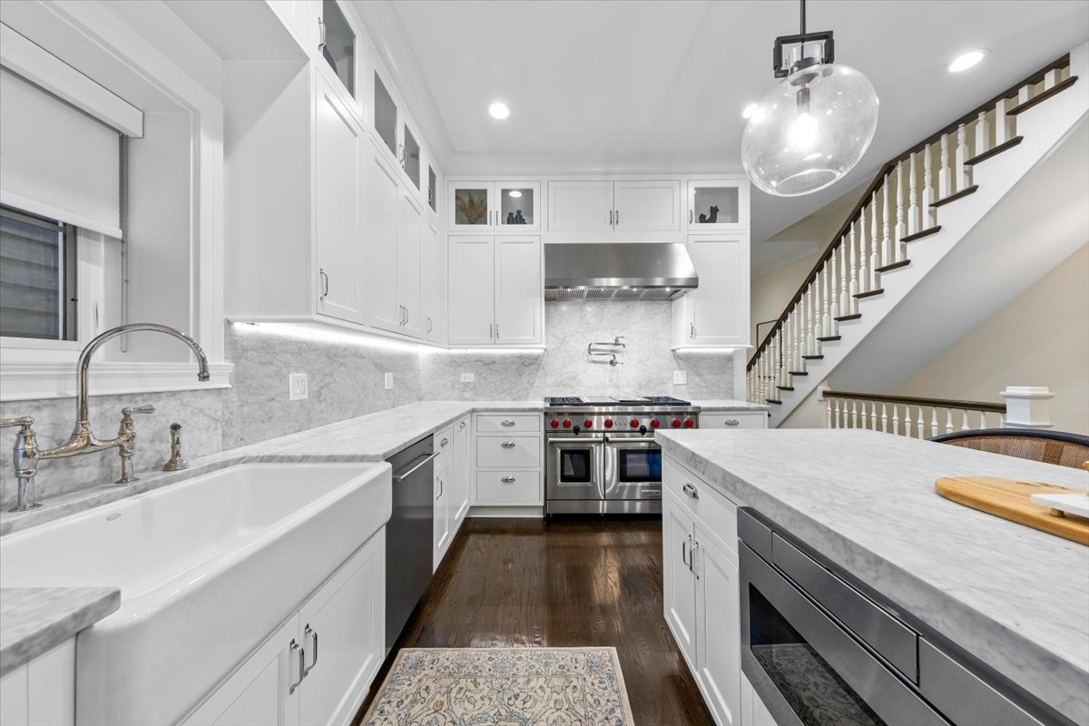 Undisclosed Address Chicago, IL 60622 - Photo 9 of 41 a kitchen with a white stove top oven and cabinets