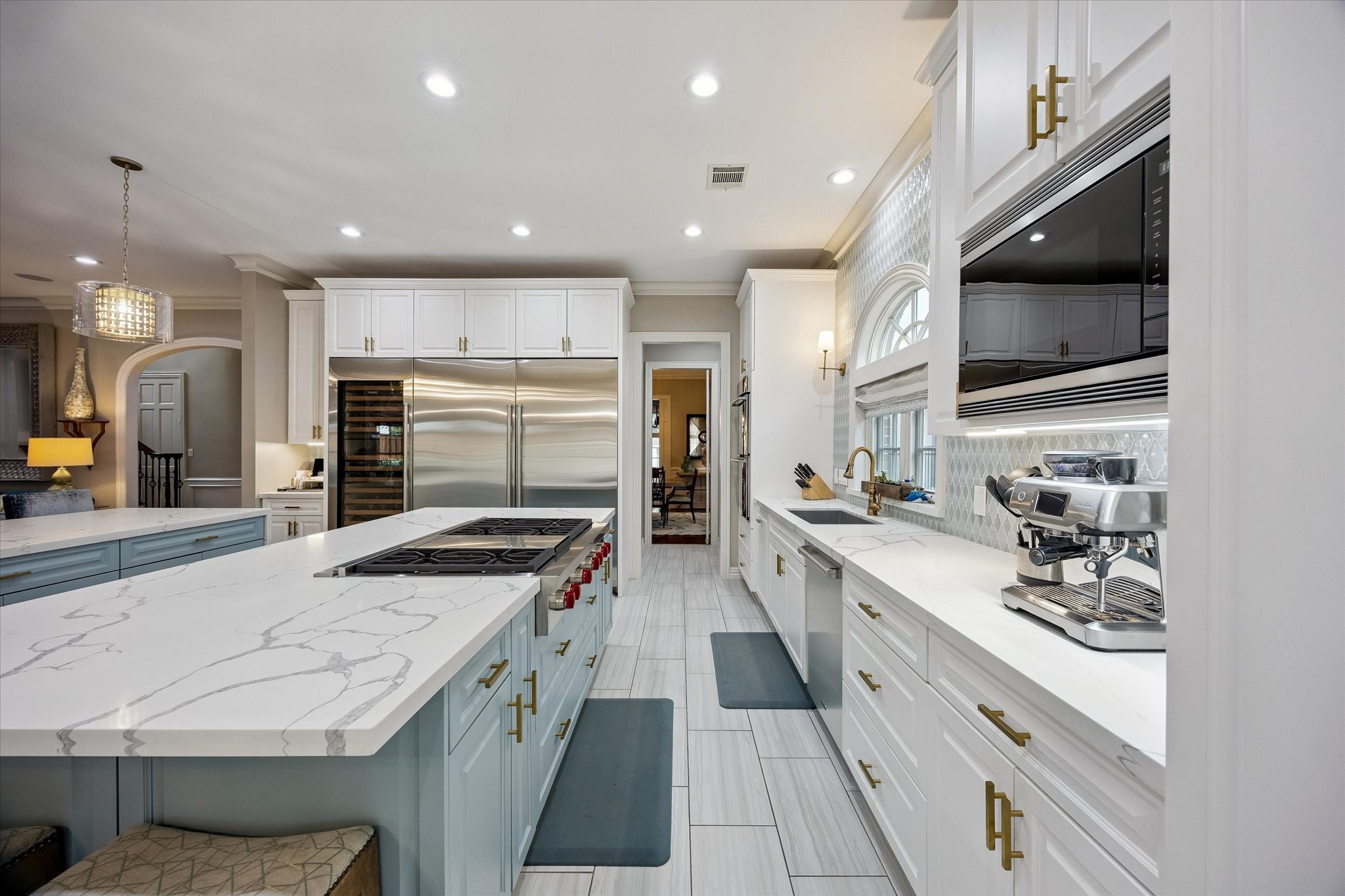 6358 Auden Street Houston, TX 77005 - Photo 15 of 50 a kitchen with stainless steel appliances kitchen island granite countertop a stove and a sink