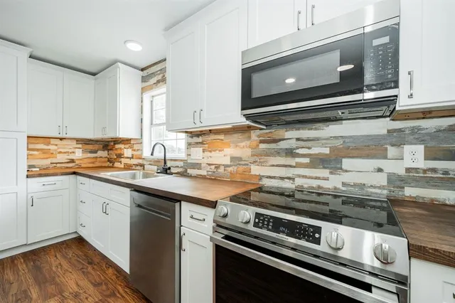 a kitchen with a stove and a microwave