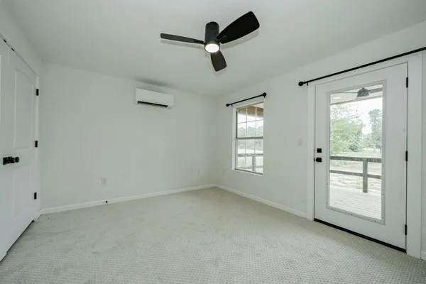 a view of empty room with ceiling window