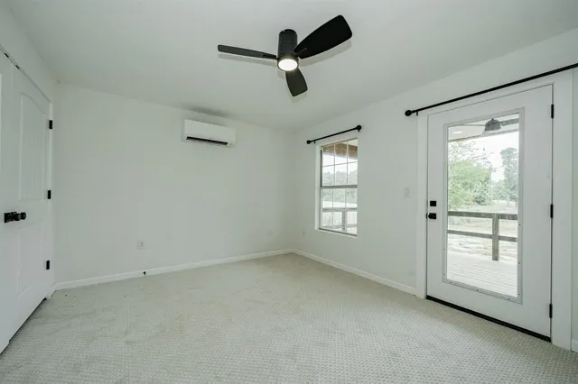 a view of empty room with ceiling window