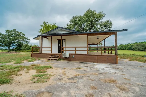 a view of a backyard of the house