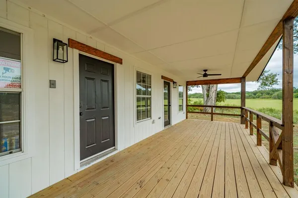 a view of balcony with wooden floor