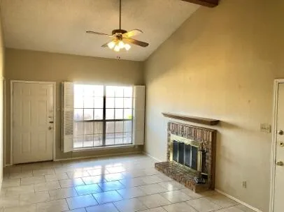 a view of an empty room with a fireplace