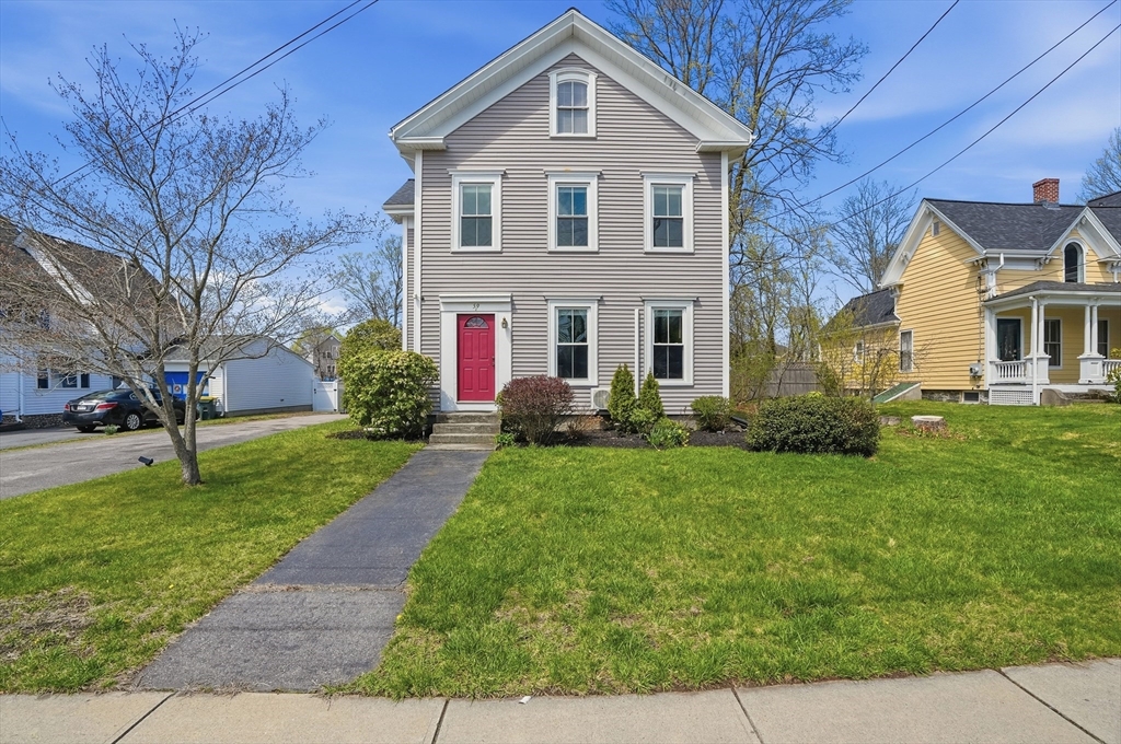 a front view of a house with a yard