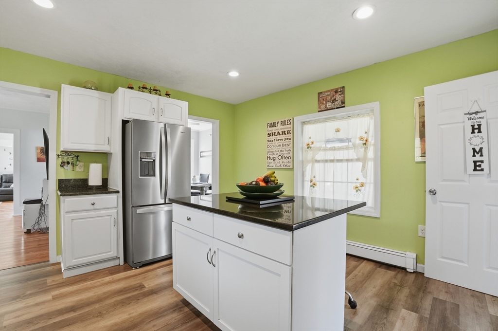 59 Cottage Street Franklin, MA 02038 - Photo 14 of 42 a kitchen with stainless steel appliances a refrigerator and a stove top oven