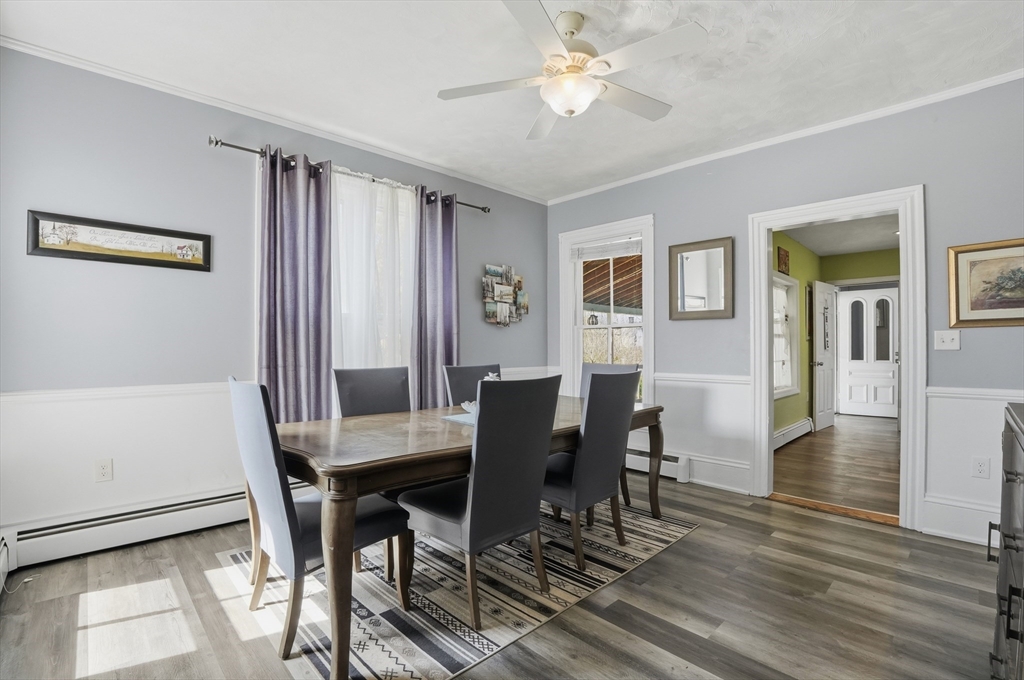 59 Cottage Street Franklin, MA 02038 - Photo 15 of 42 a view of a dining room with furniture and wooden floor