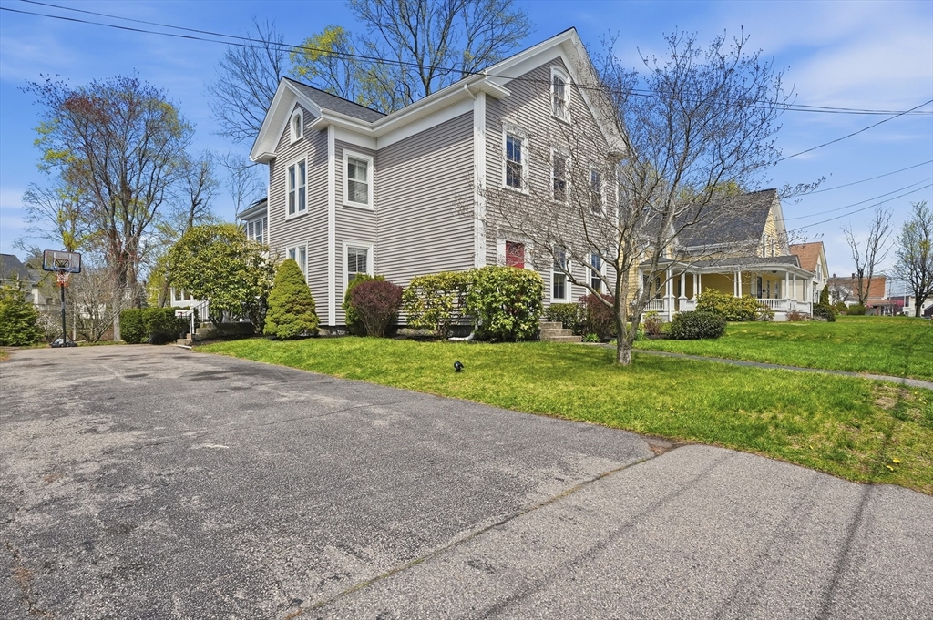 59 Cottage Street Franklin, MA 02038 - Photo 2 of 42 a front view of house with yard and green space
