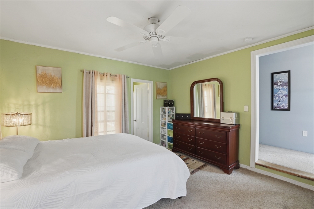 59 Cottage Street Franklin, MA 02038 - Photo 22 of 42 a bedroom with a bed and a dresser