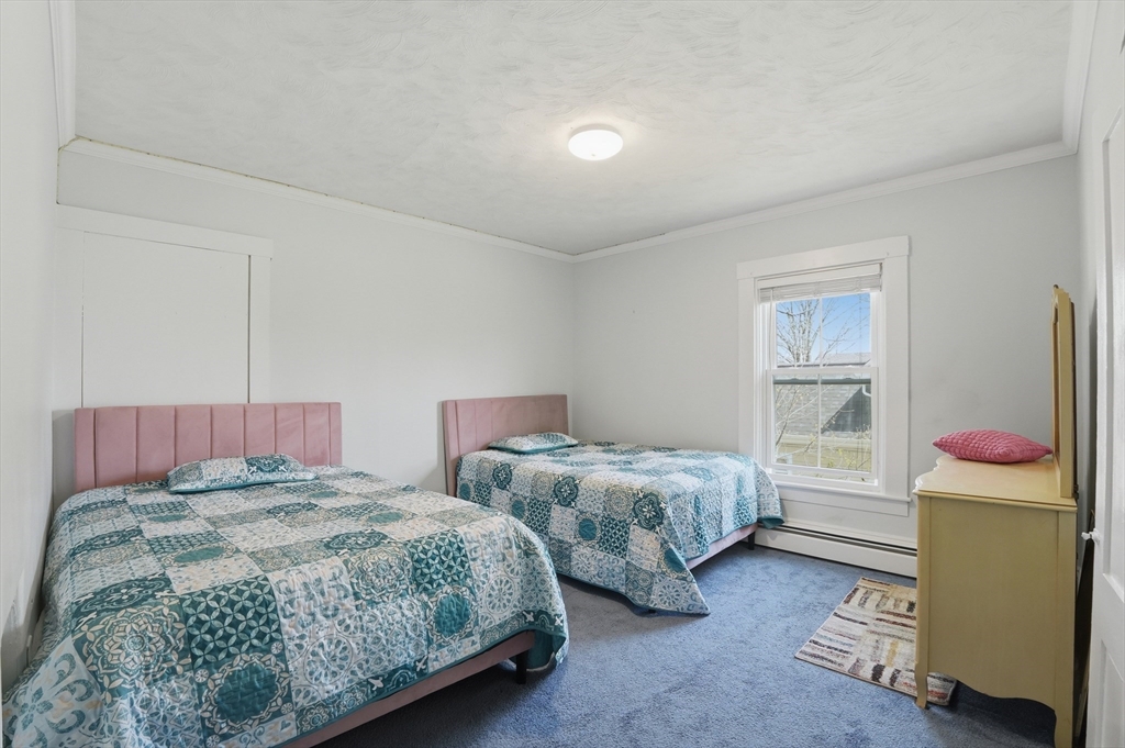 59 Cottage Street Franklin, MA 02038 - Photo 27 of 42 a bedroom with two beds and a window