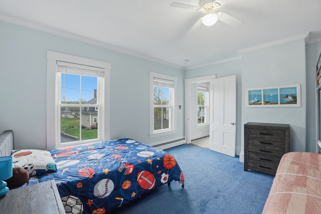 59 Cottage Street Franklin, MA 02038 - Photo 29 of 42 a bedroom with a bed and window
