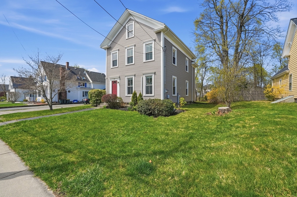 59 Cottage Street Franklin, MA 02038 - Photo 3 of 42 a front view of house with yard and green space