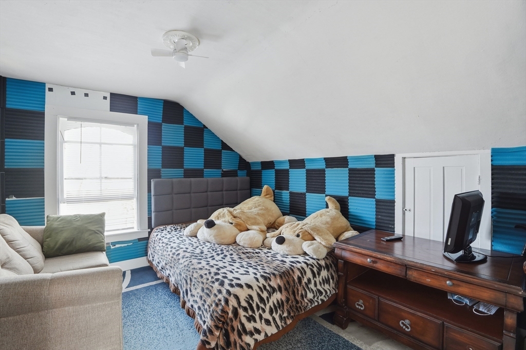 59 Cottage Street Franklin, MA 02038 - Photo 31 of 42 a bedroom with a bed and wooden floor