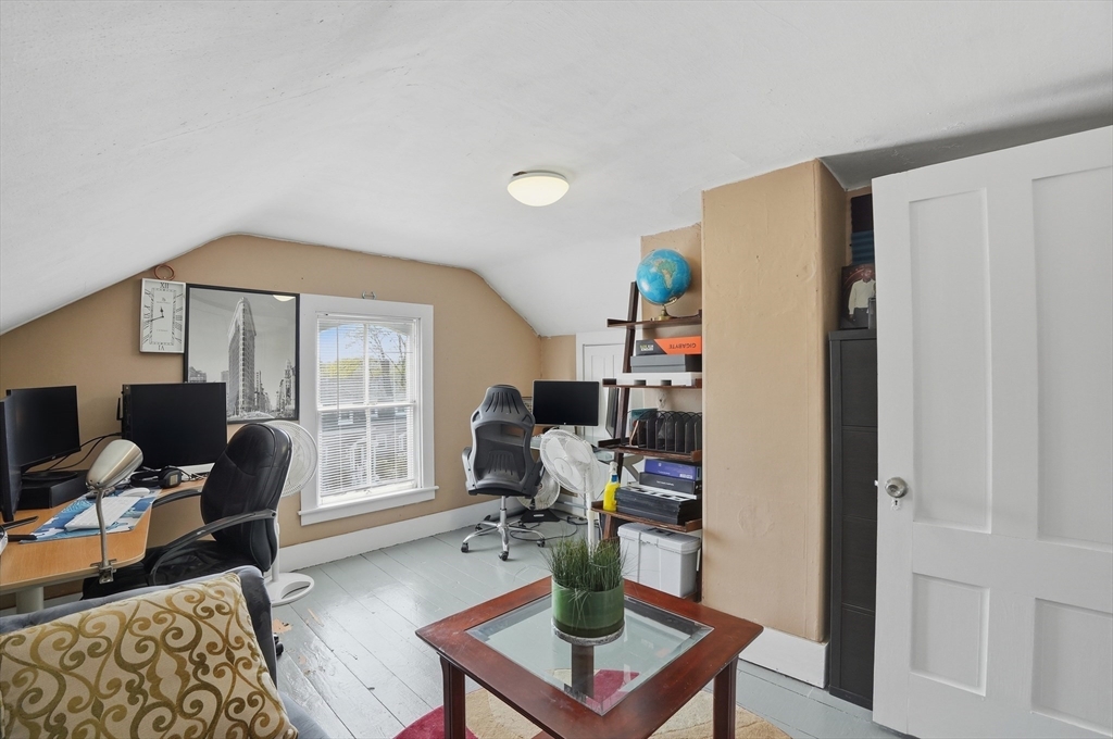 59 Cottage Street Franklin, MA 02038 - Photo 35 of 42 a living room with furniture a rug and a window