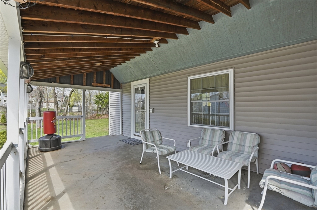 59 Cottage Street Franklin, MA 02038 - Photo 37 of 42 a backyard of a house with table and chairs