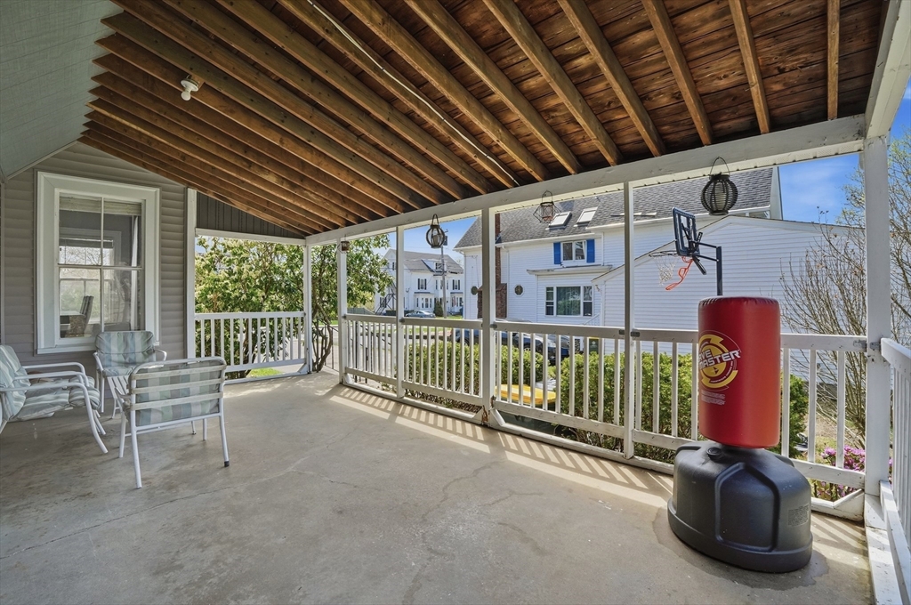 59 Cottage Street Franklin, MA 02038 - Photo 38 of 42 a view of porch with a table and chairs