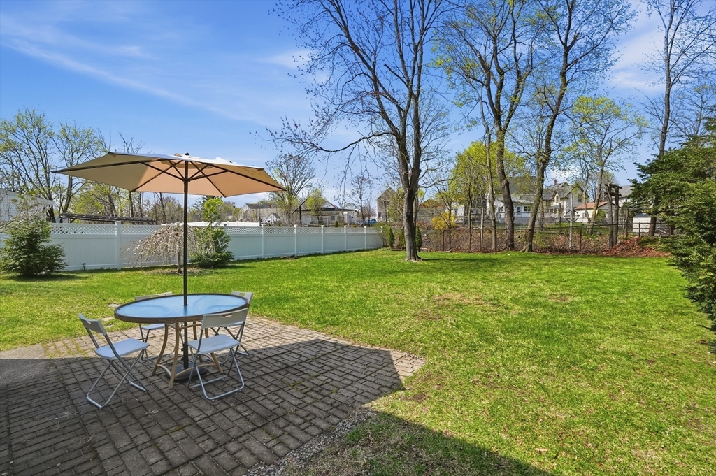 59 Cottage Street Franklin, MA 02038 - Photo 41 of 42 a swimming pool with outdoor seating and yard