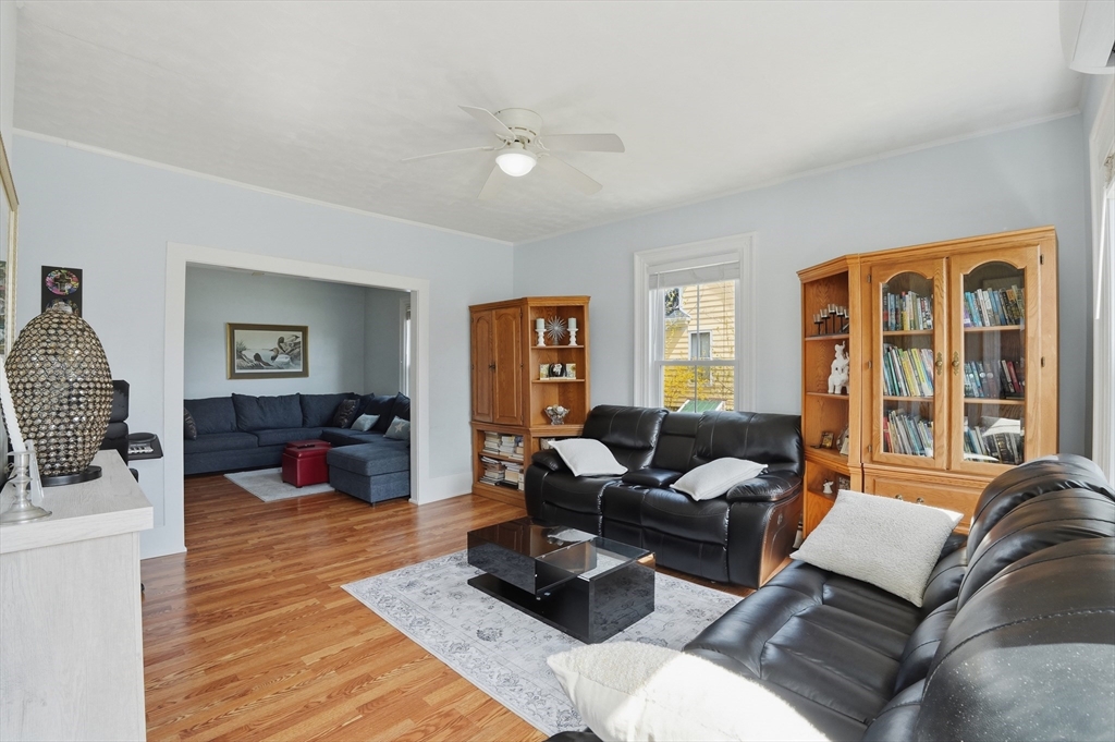 59 Cottage Street Franklin, MA 02038 - Photo 9 of 42 a living room with furniture or couch and a flat screen tv