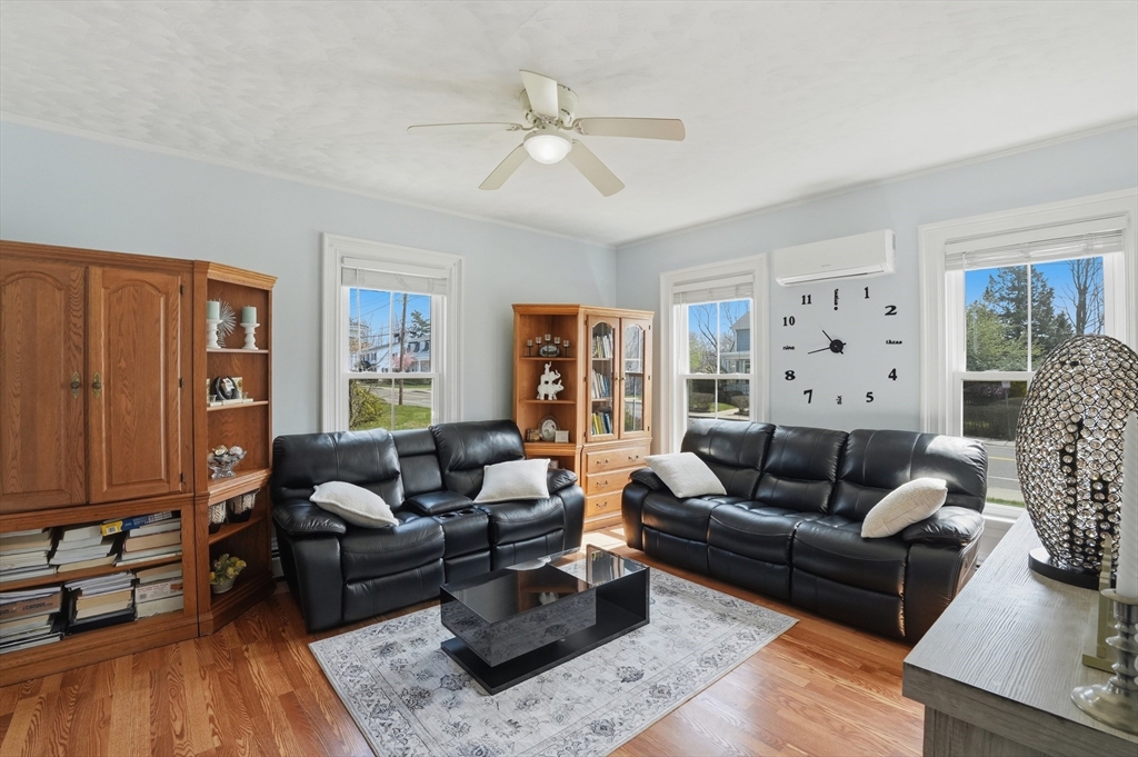 59 Cottage Street Franklin, MA 02038 - Photo 10 of 42 a living room with furniture and wooden floor