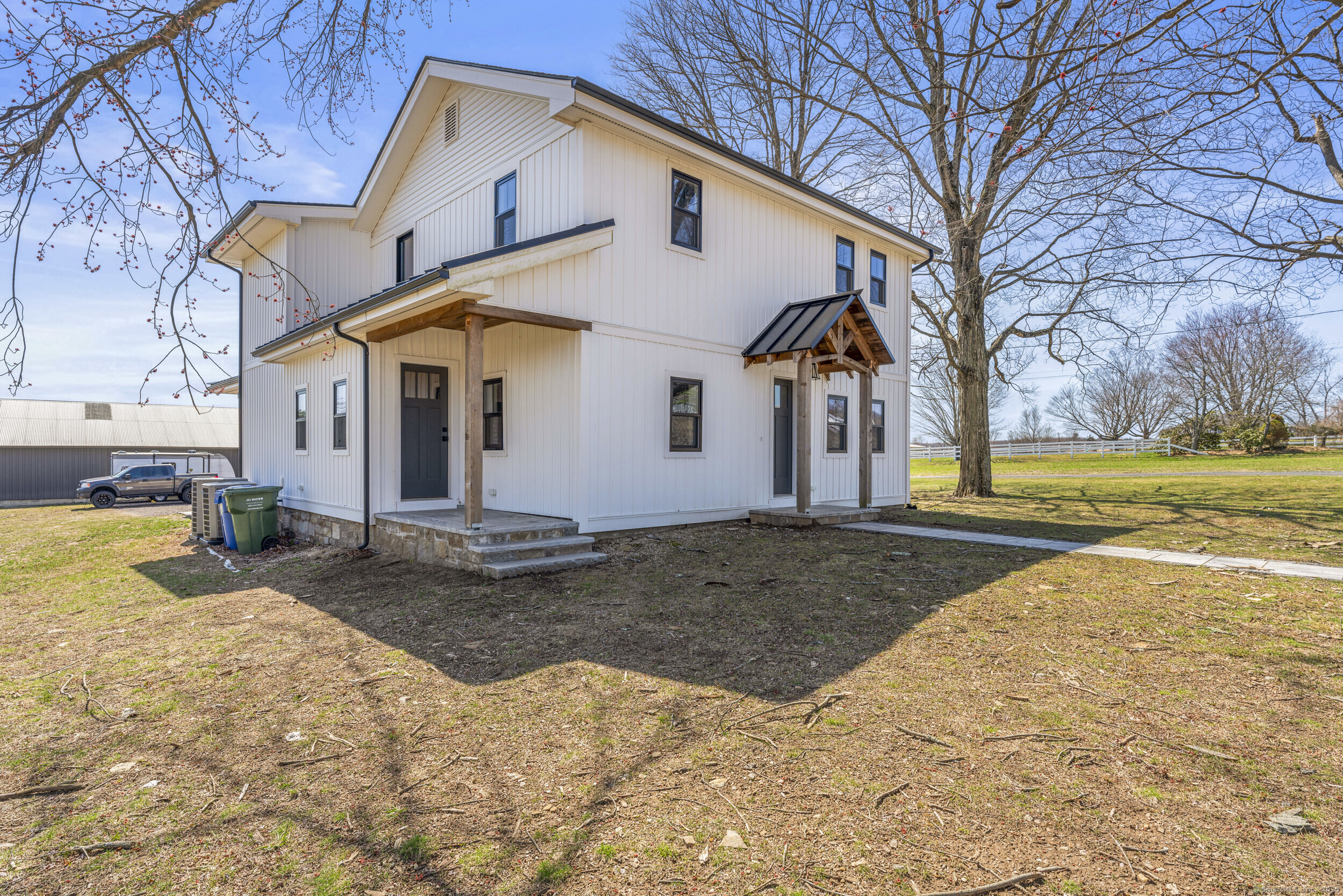 183 Bailey Street Glastonbury, CT 06033 - Photo 1 of 1 a view of a white house with a yard covered in snow