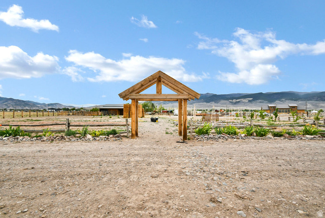 544 East 600 North, Unit 1 Joseph, UT 84739 - Photo 35 of 65 Outdoor property featuring a rustic timber frame gateway, split rail fencing, and cultivated garden beds