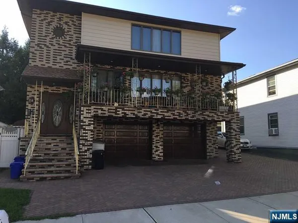 a front view of a house with parking