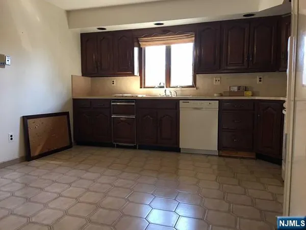 a kitchen with a cabinets and window