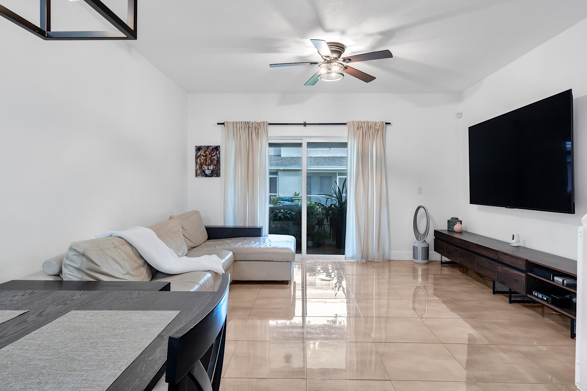 12 Fleming Court Weston, FL 33326 - Photo 17 of 51 a living room with furniture and a flat screen tv