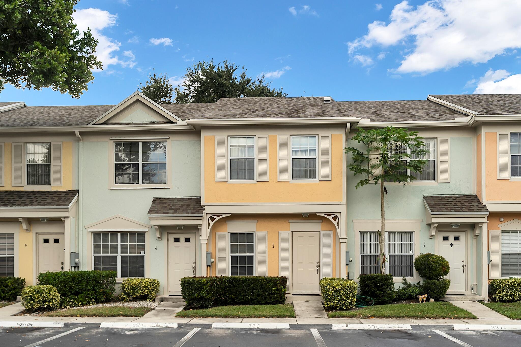 12 Fleming Court Weston, FL 33326 - Photo 2 of 51 a front view of a house with a yard and garage