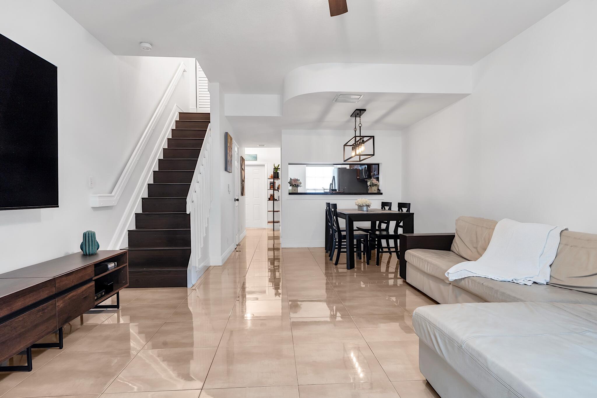 12 Fleming Court Weston, FL 33326 - Photo 23 of 51 a living room with furniture and a flat screen tv