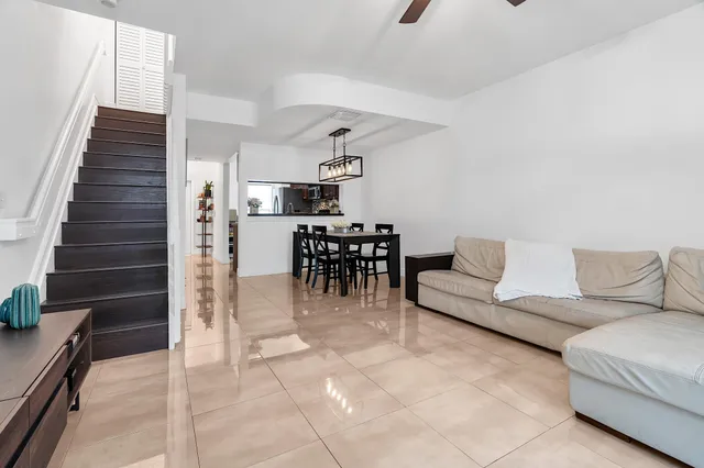 a view of a hallway with wooden floor and entryway