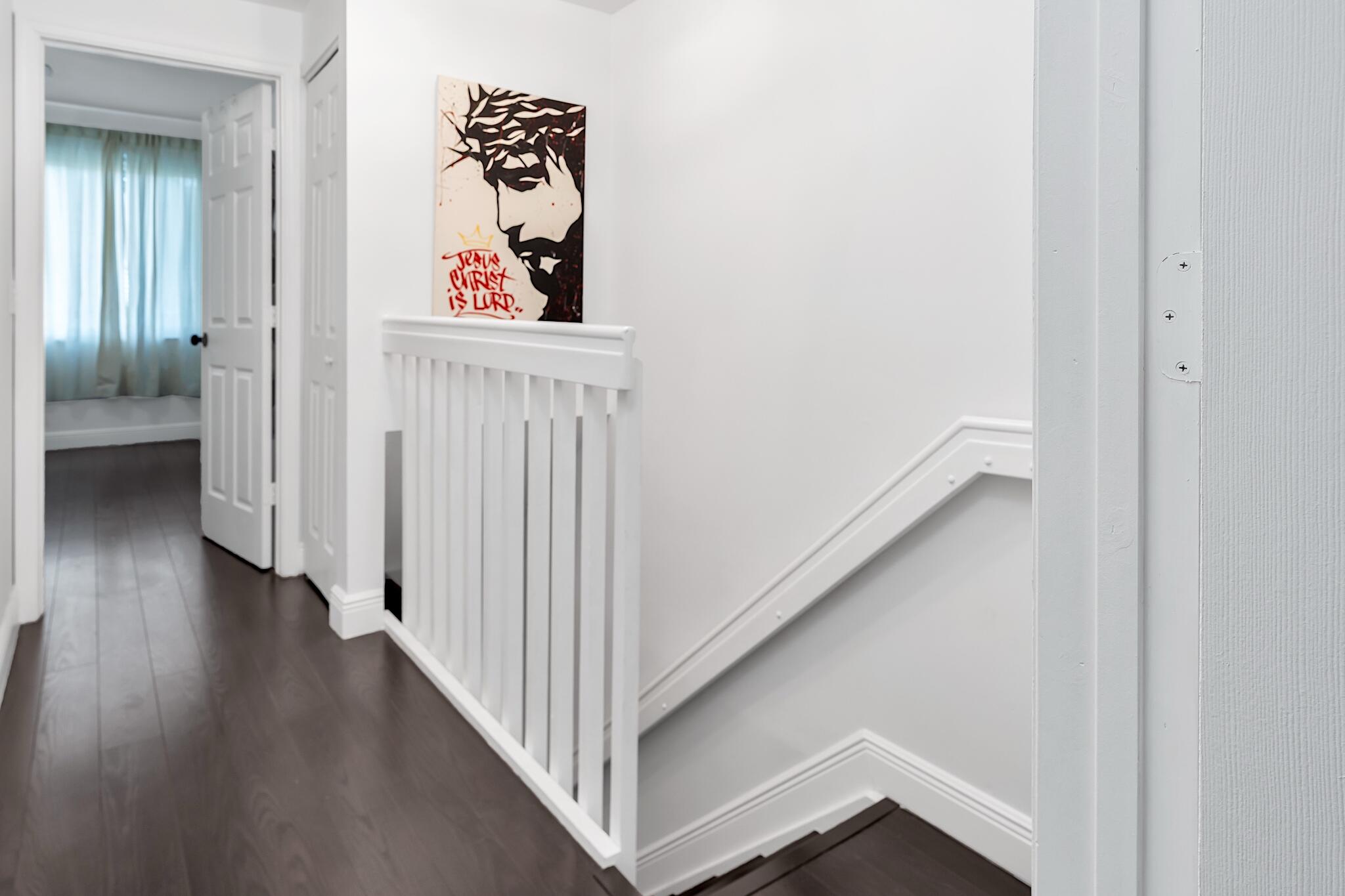 12 Fleming Court Weston, FL 33326 - Photo 26 of 51 a view of a hallway with wooden floor and entryway