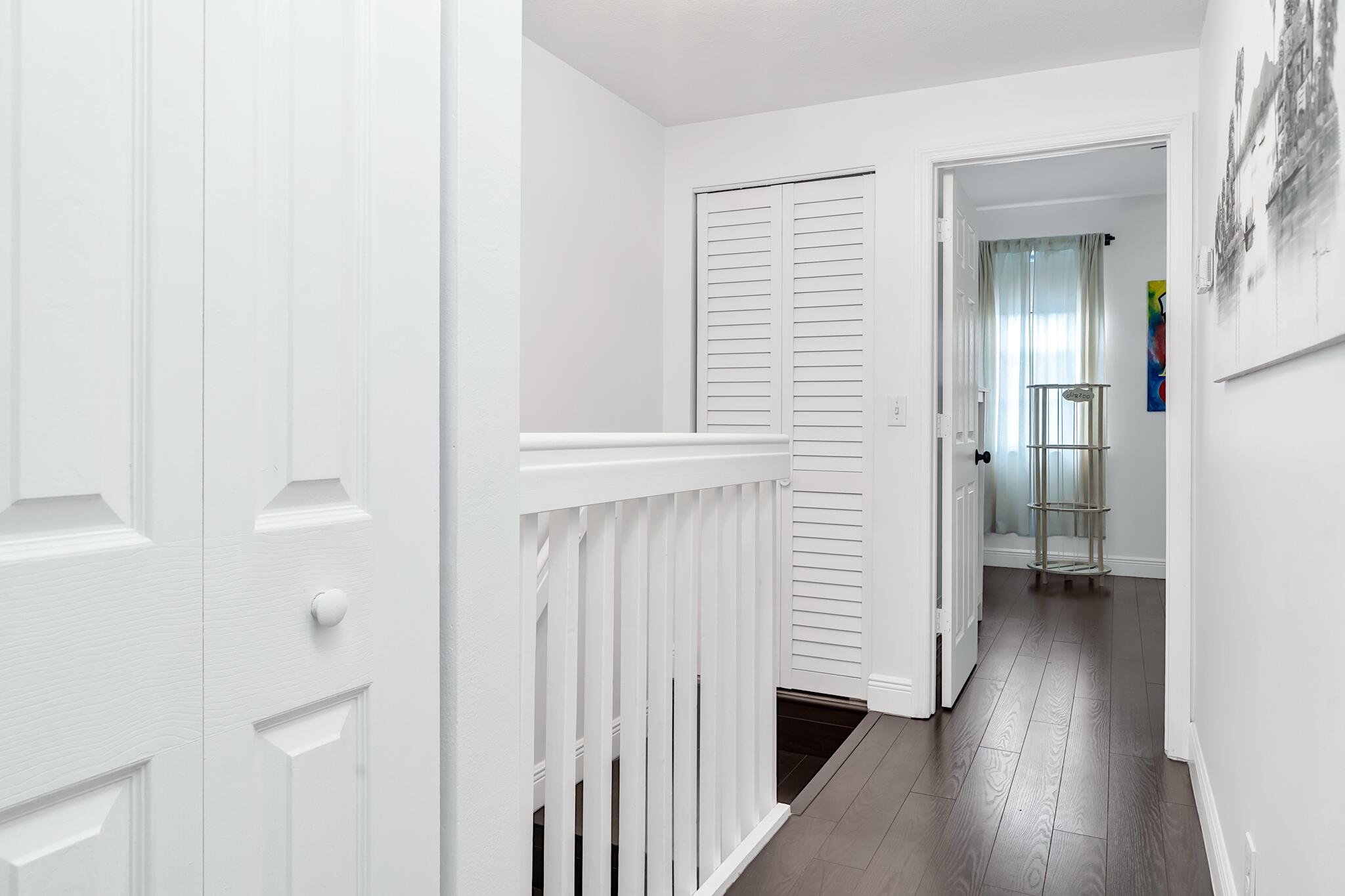 12 Fleming Court Weston, FL 33326 - Photo 28 of 51 a view of a hallway with wooden floor and closet